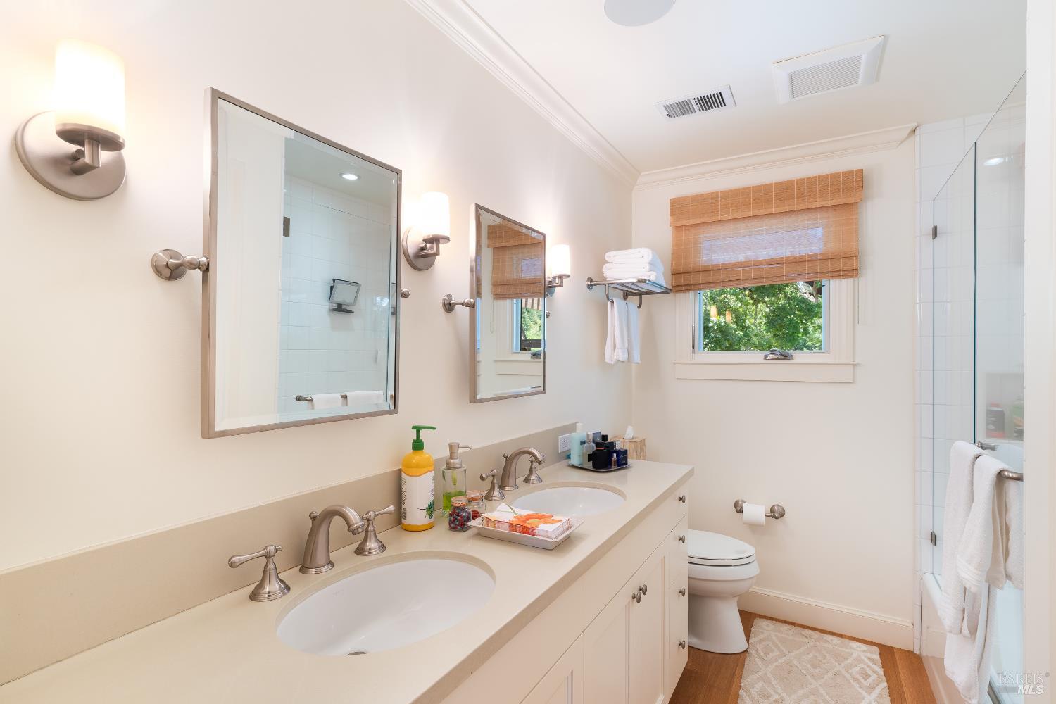 4500 Redwood Road Napa, CA 94558 - Photo 16 of 86 a bathroom with a granite countertop sink mirror vanity and toilet