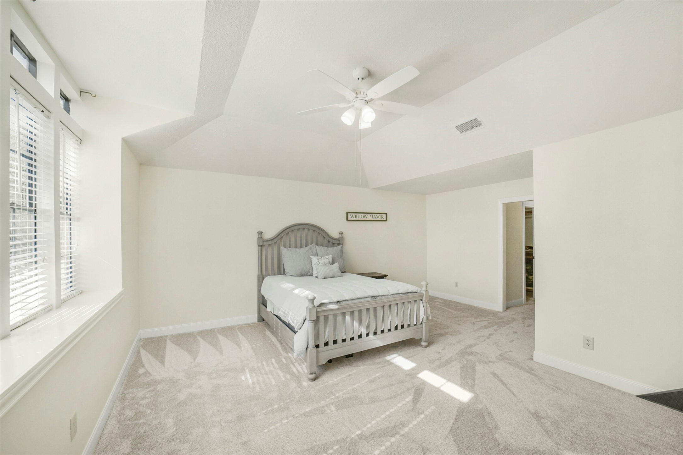 17302 Atherington Place Spring, TX 77379 - Photo 40 of 50 This spacious secondary bedroom features a light and bright atmosphere, enhanced by its inviting vaulted ceilings, creating a truly comfortable and desirable space.