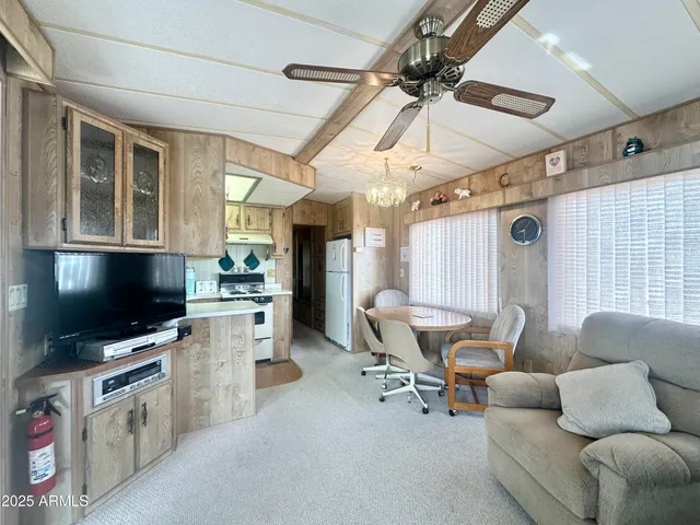 a kitchen with stainless steel appliances a stove a sink and a refrigerator