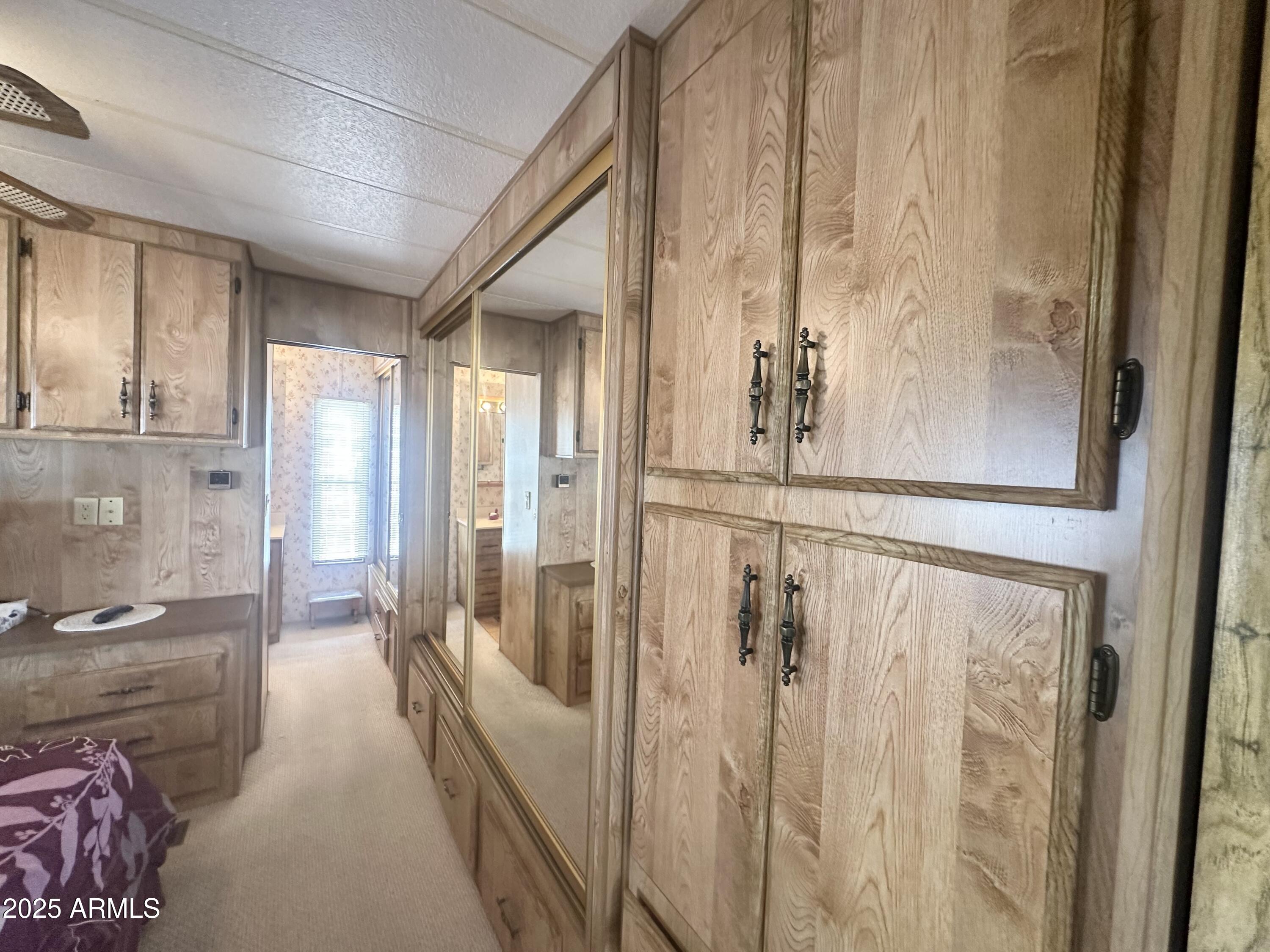 3710 South Goldfield Road, Unit 1052 Apache Junction, AZ 85119 - Photo 22 of 48 a view of a hallway with windows