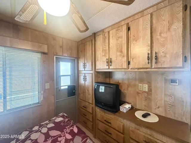 a view of a chairs and table in the patio