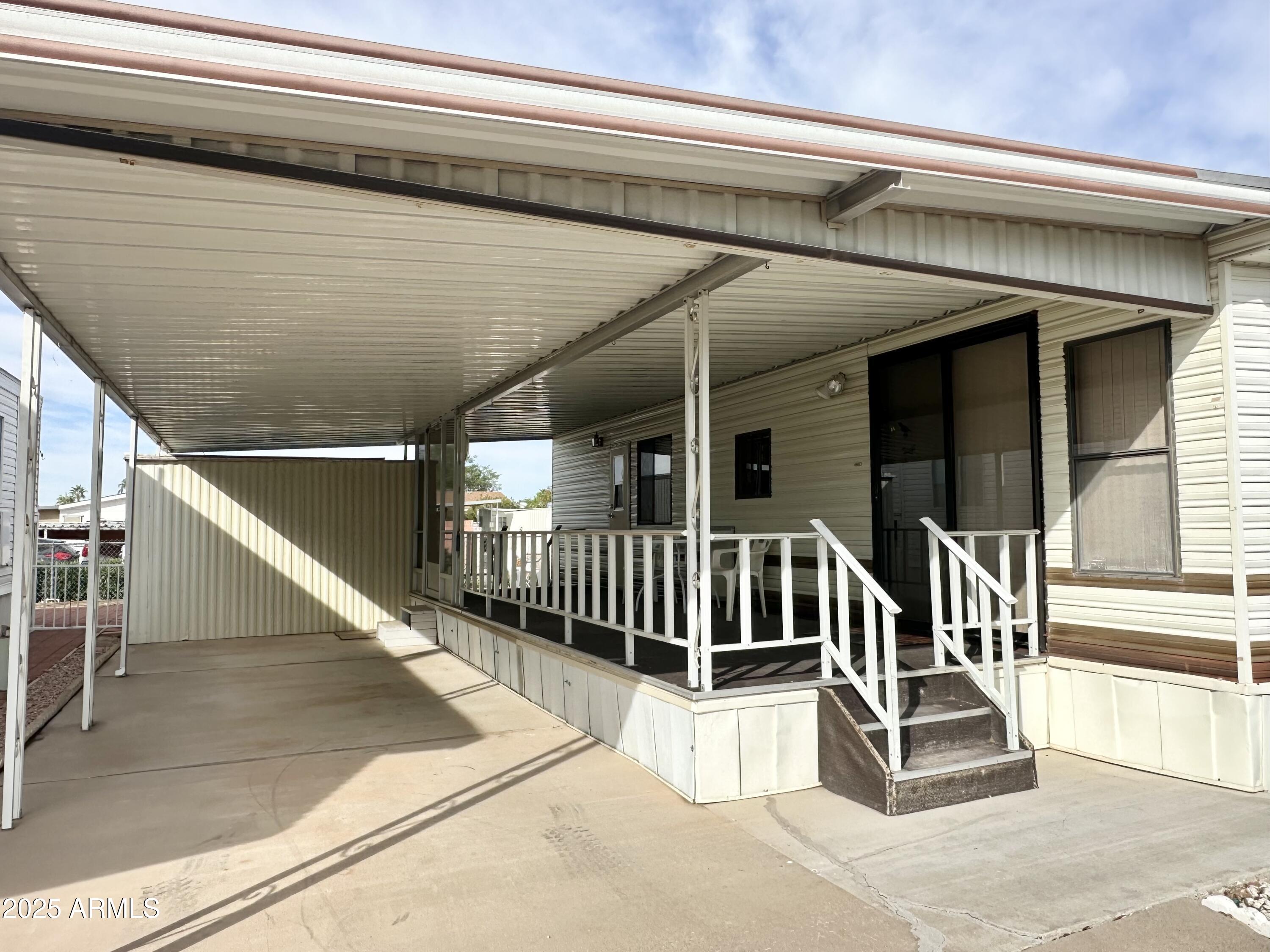 3710 South Goldfield Road, Unit 1052 Apache Junction, AZ 85119 - Photo 3 of 48 a view of entryway with a front door