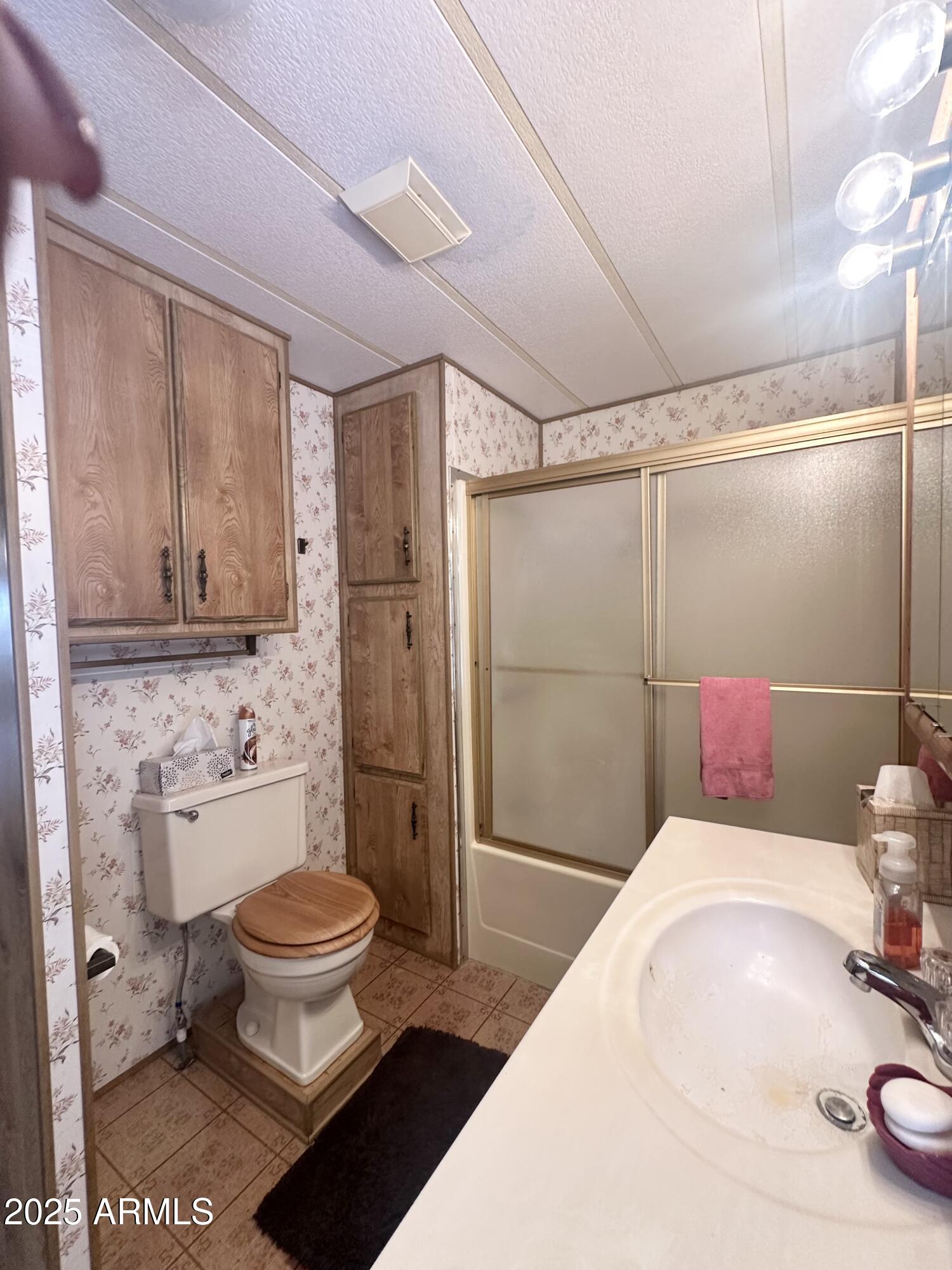 3710 South Goldfield Road, Unit 1052 Apache Junction, AZ 85119 - Photo 31 of 48 STOOL/MORE CABINETS