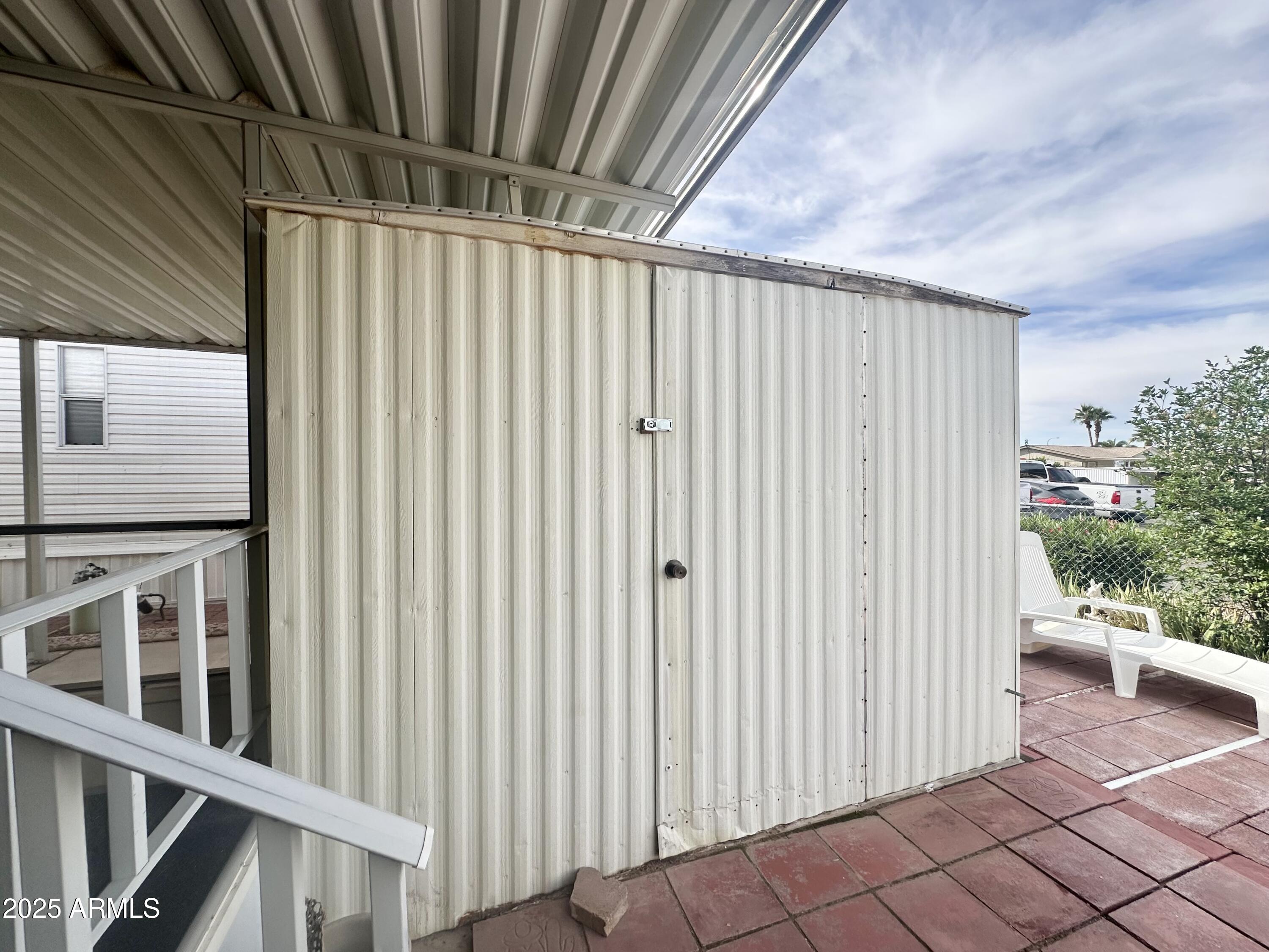 3710 South Goldfield Road, Unit 1052 Apache Junction, AZ 85119 - Photo 34 of 48 a view of a porch