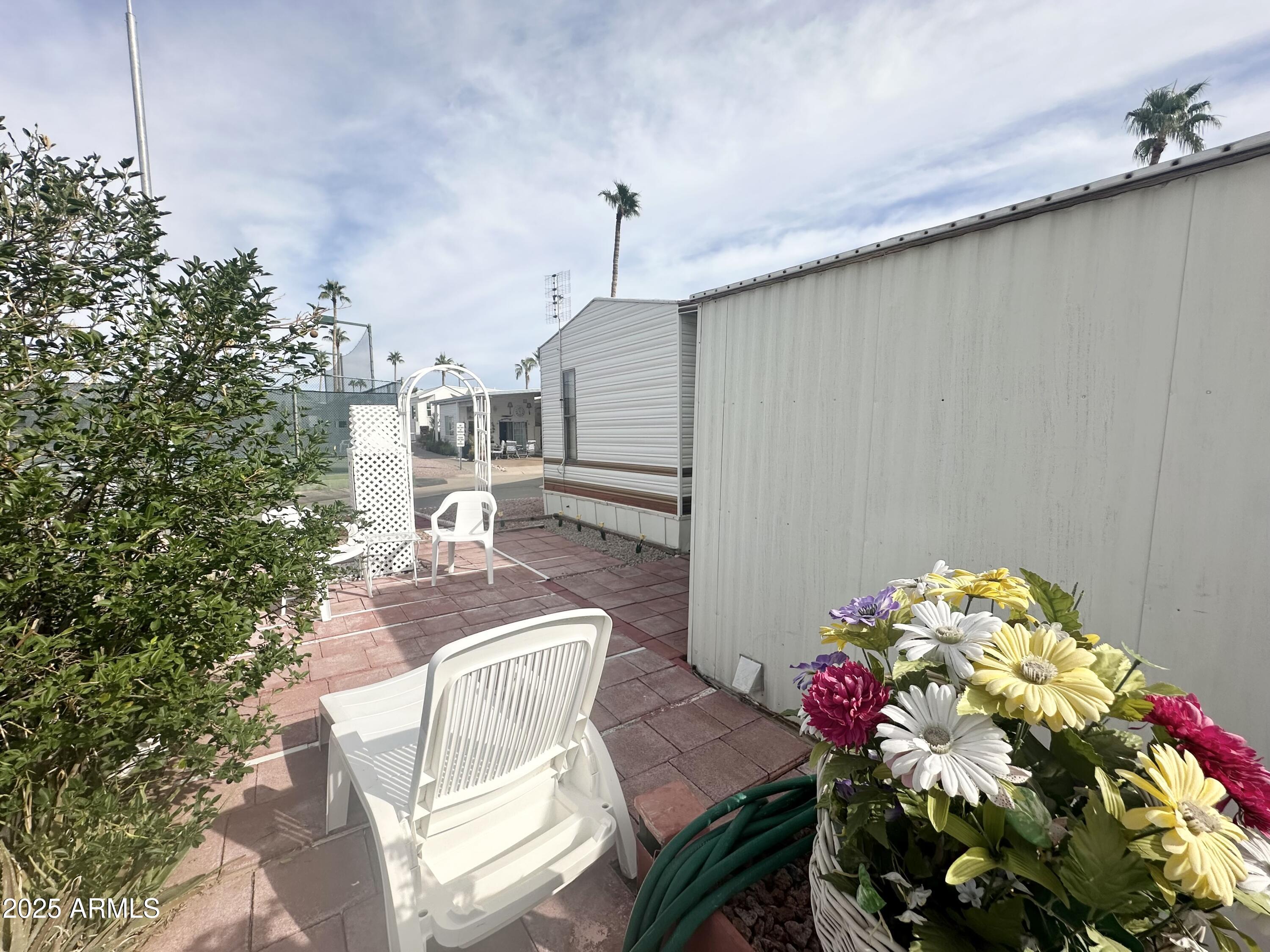 3710 South Goldfield Road, Unit 1052 Apache Junction, AZ 85119 - Photo 39 of 48 LOUNGE THE DAY AWAY