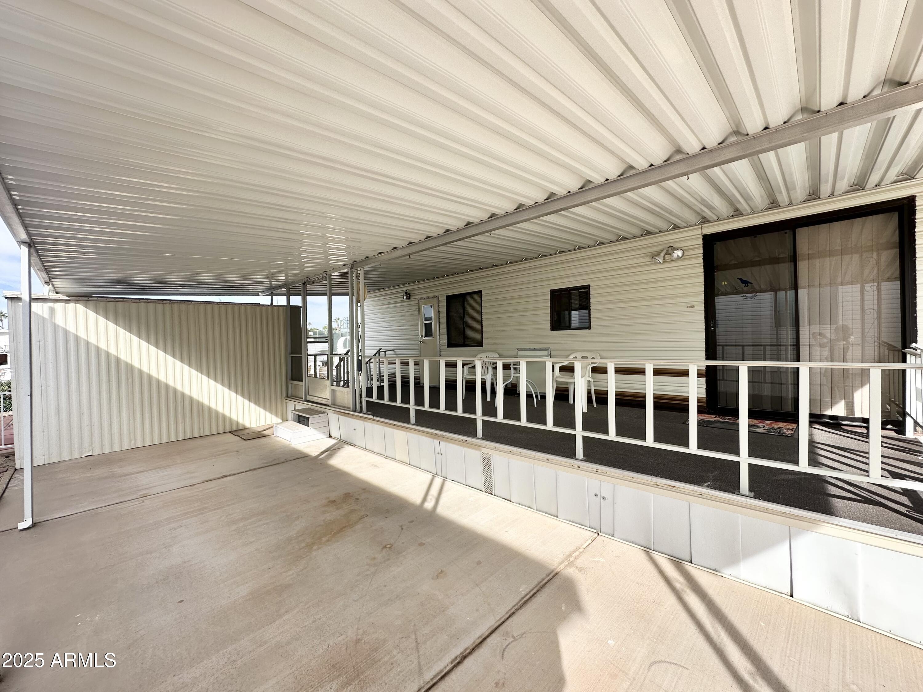 3710 South Goldfield Road, Unit 1052 Apache Junction, AZ 85119 - Photo 4 of 48 a view of a large white building