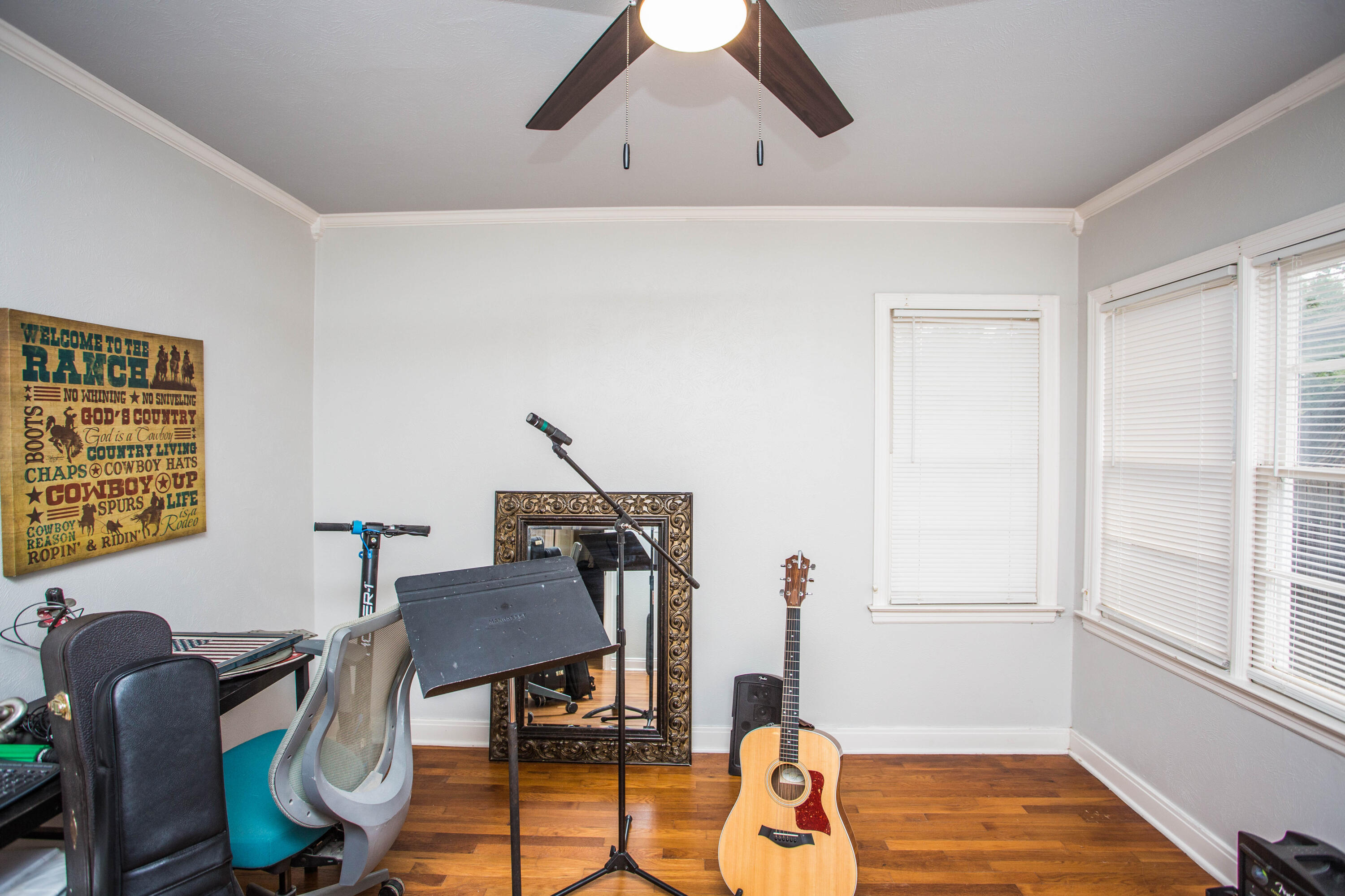 2712 30th Street Lubbock, TX 79410 - Photo 14 of 26 a view of a workspace with furniture and a window