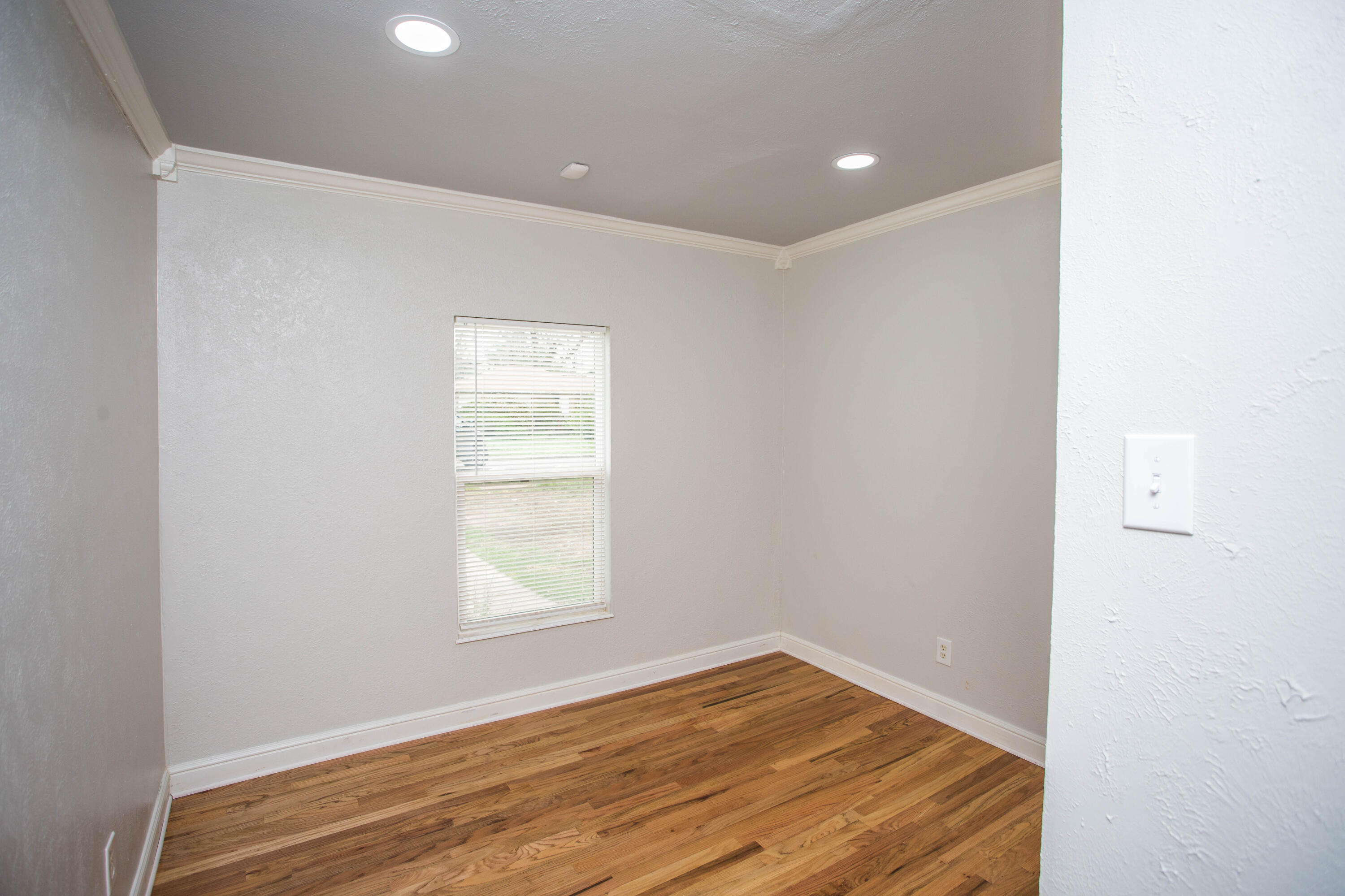 2712 30th Street Lubbock, TX 79410 - Photo 20 of 26 a view of empty room with wooden floor