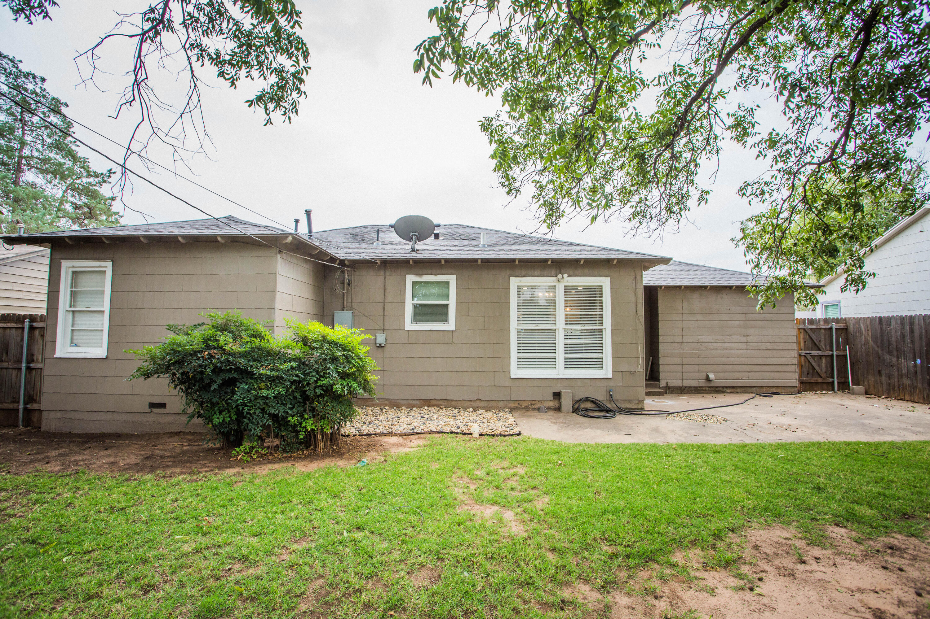 2712 30th Street Lubbock, TX 79410 - Photo 26 of 26 a view of a house with a yard and plants