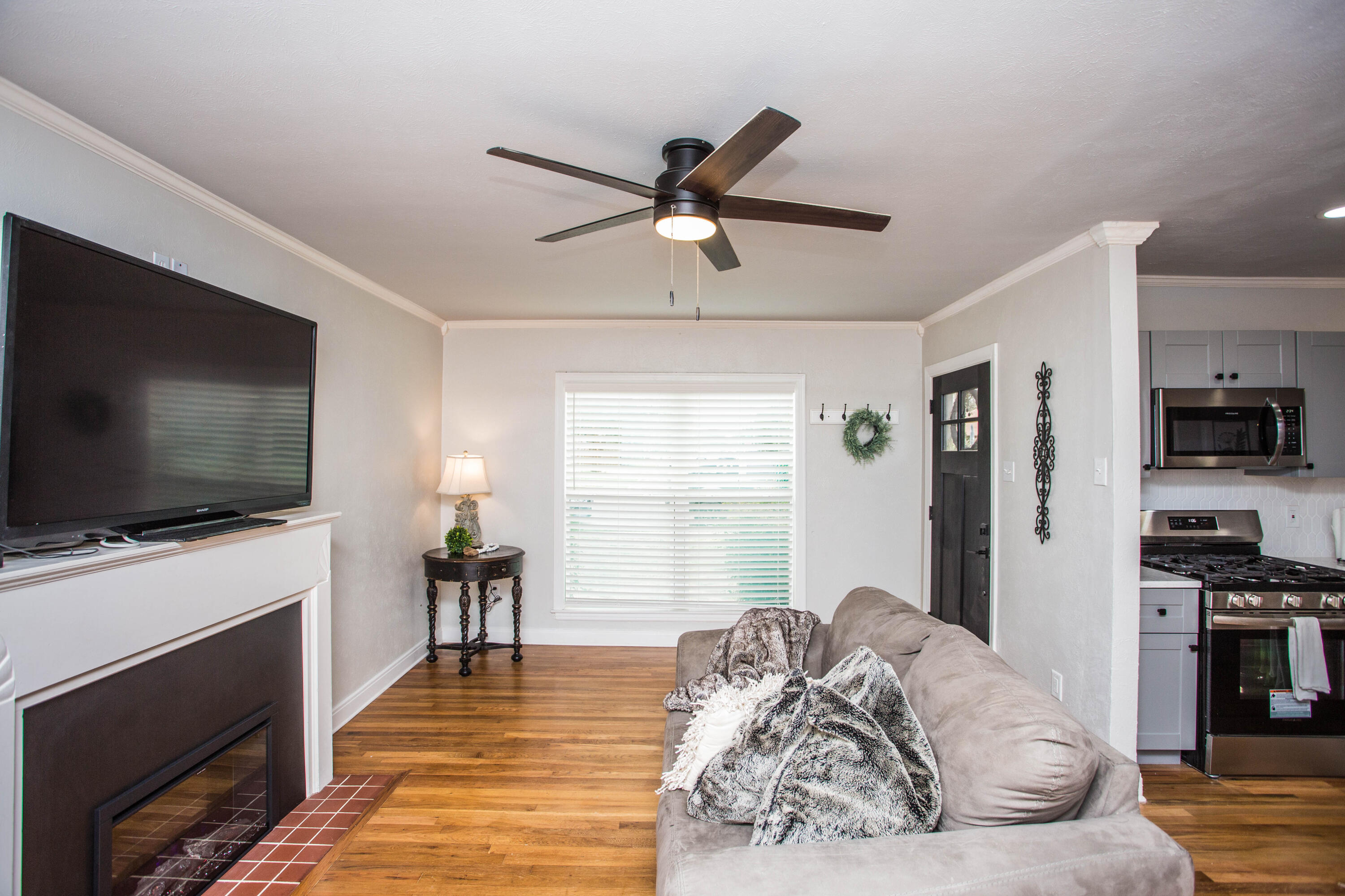 2712 30th Street Lubbock, TX 79410 - Photo 3 of 26 a living room with furniture and a flat screen tv