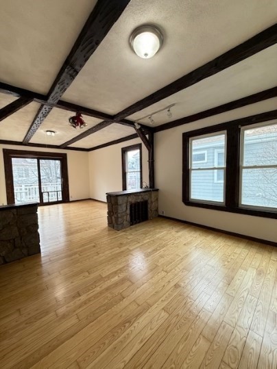 5 Alcott Street, Unit 2 Boston, MA 02134 - Photo 3 of 14 a view of empty room with wooden floor and fan