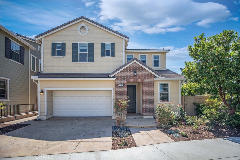 94 Shadowbrook Irvine, CA 92604 - Photo 1 of 1 a front view of a house with garden