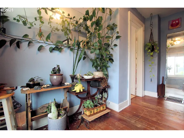 a kitchen with a sink a window and cabinets