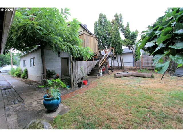 a view of a back yard from a balcony