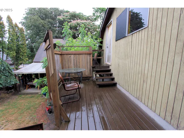 a view of living room with furniture and a window