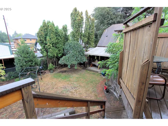 a view of a chairs in a backyard