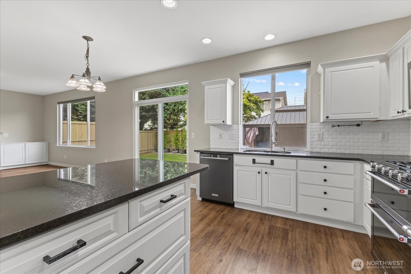 14912 48th Avenue Southeast Bothell, WA 98012 - Photo 14 of 40 a kitchen with granite countertop white cabinets and white appliances