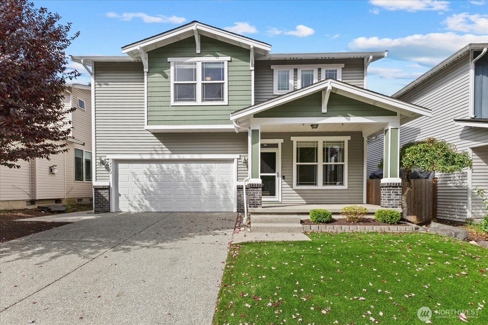 14912 48th Avenue Southeast Bothell, WA 98012 - Photo 2 of 40 a front view of a house with a yard