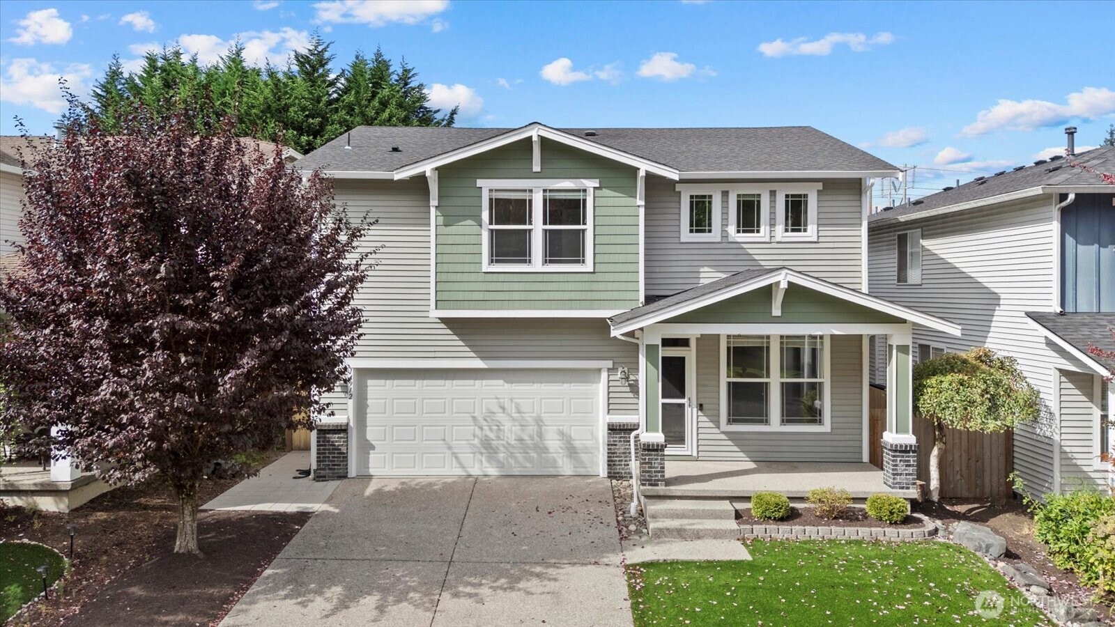 14912 48th Avenue Southeast Bothell, WA 98012 - Photo 3 of 40 a front view of a house with a yard