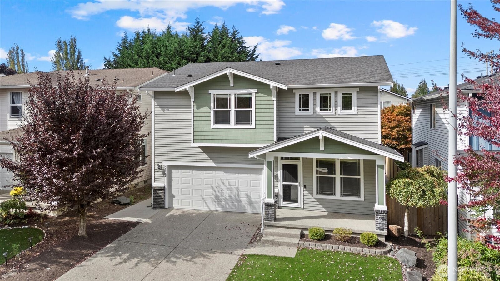 14912 48th Avenue Southeast Bothell, WA 98012 - Photo 4 of 40 a front view of a house with a yard