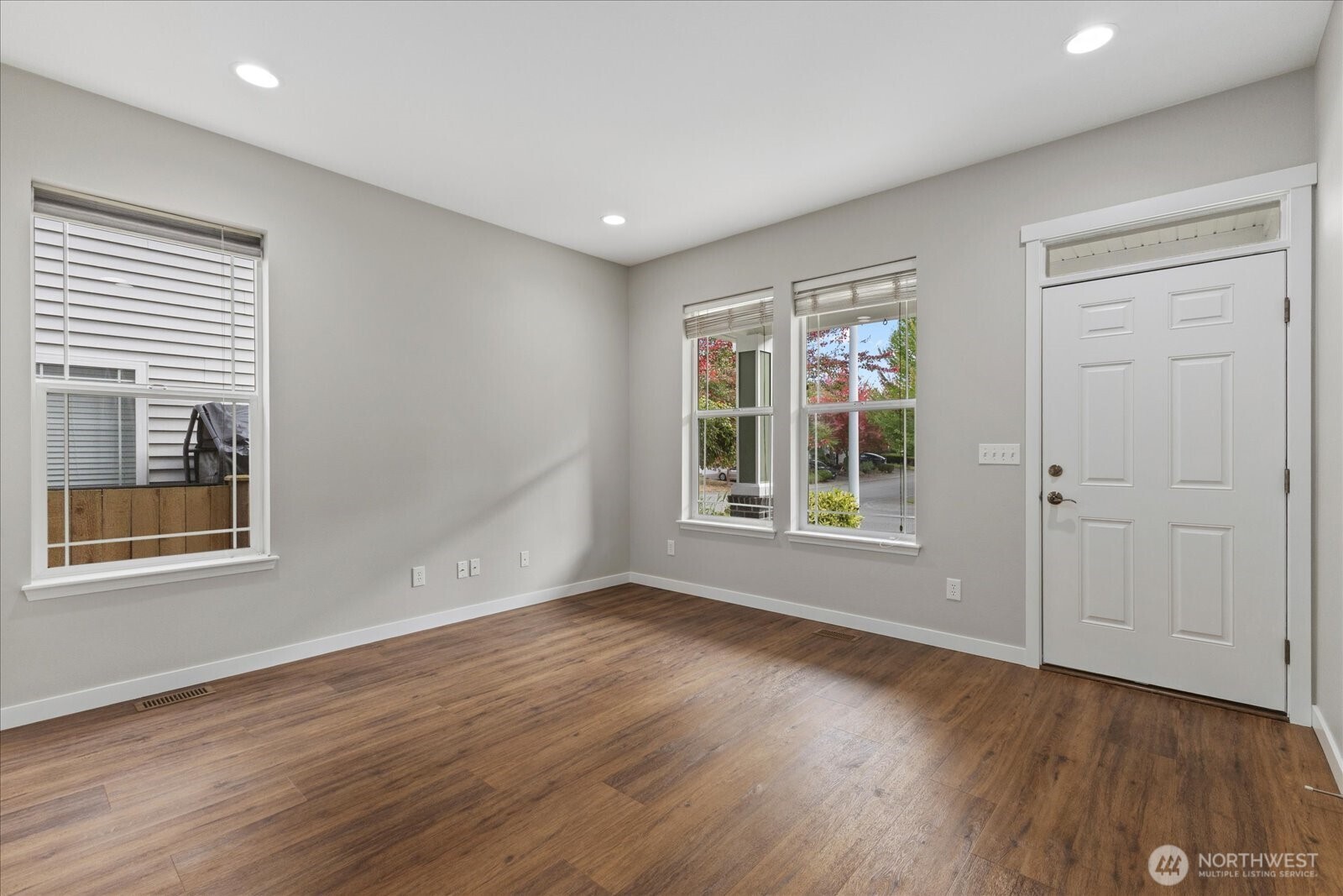 14912 48th Avenue Southeast Bothell, WA 98012 - Photo 5 of 40 a view of an empty room with wooden floor and a window
