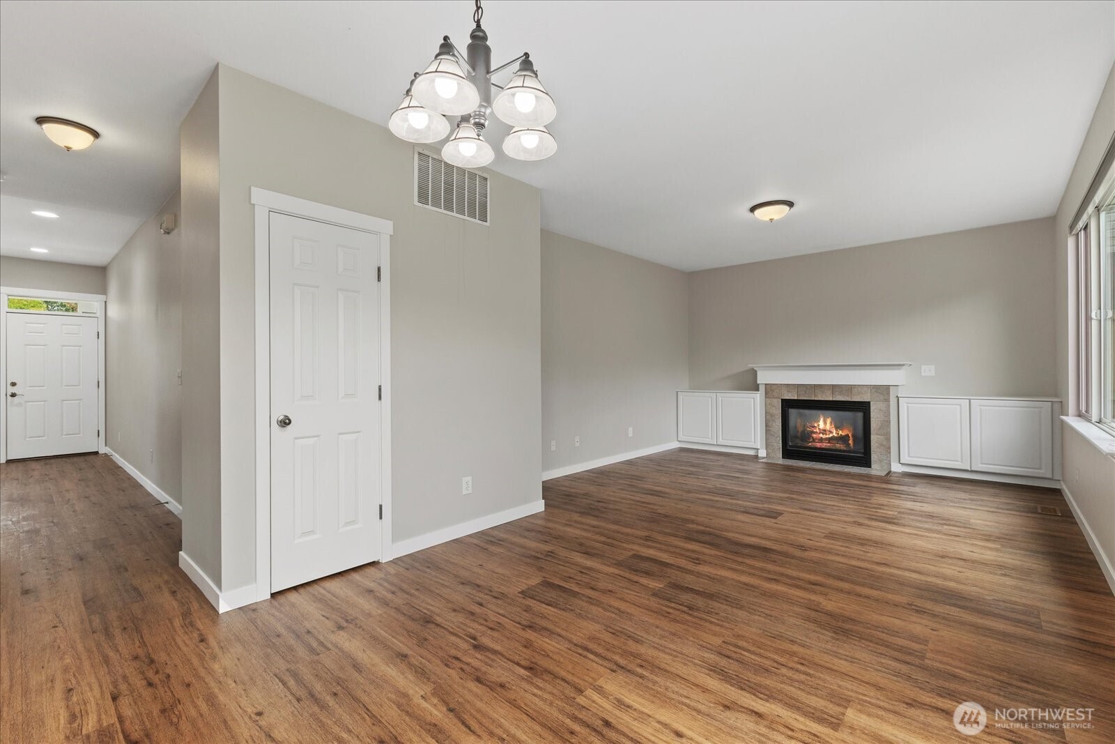 14912 48th Avenue Southeast Bothell, WA 98012 - Photo 8 of 40 a view of an empty room with wooden floor and a window