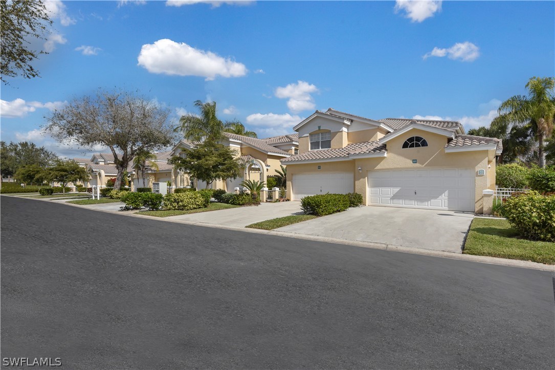 6838 Lantana Bridge Road, Unit 102 Naples, FL 34109 - Photo 2 of 34 a view of a house with a street