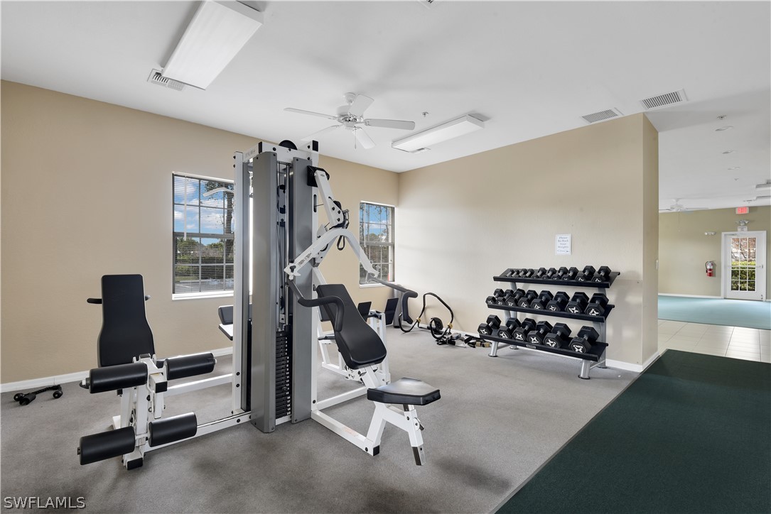 6838 Lantana Bridge Road, Unit 102 Naples, FL 34109 - Photo 29 of 34 a view of a room with gym equipment