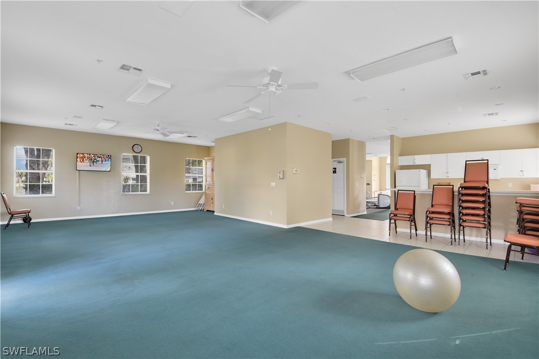 6838 Lantana Bridge Road, Unit 102 Naples, FL 34109 - Photo 30 of 34 a view of a livingroom with furniture and window