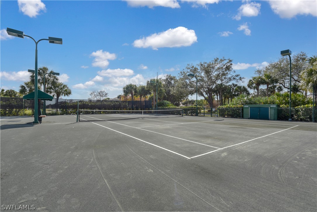 6838 Lantana Bridge Road, Unit 102 Naples, FL 34109 - Photo 31 of 34 a view of a tennis court