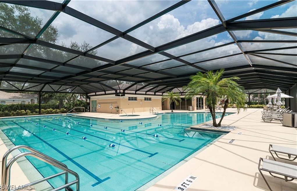 6838 Lantana Bridge Road, Unit 102 Naples, FL 34109 - Photo 34 of 34 a view of a swimming pool with a patio