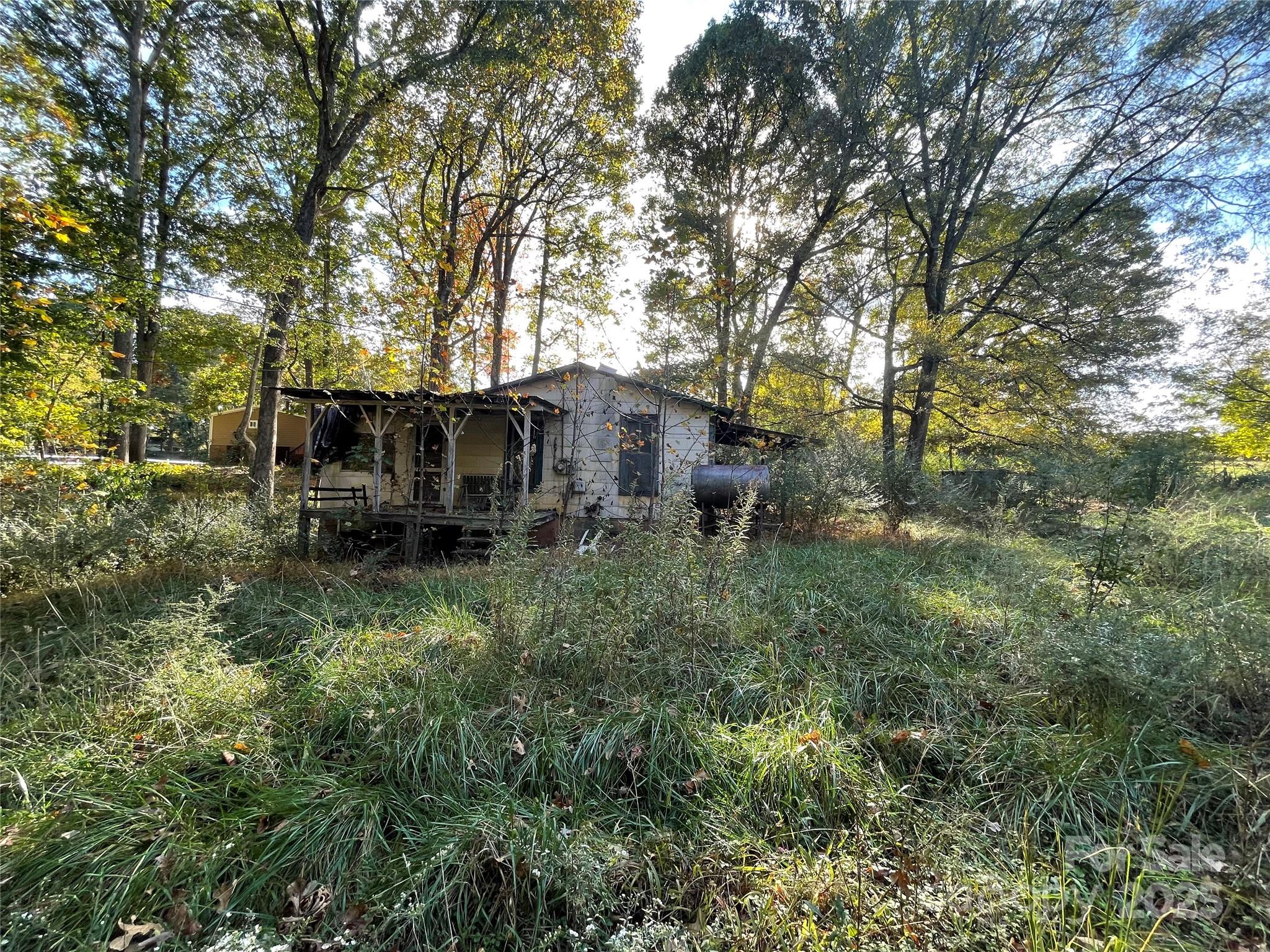137 Stacy Road Mooresville, NC 28115 - Photo 2 of 9 a backyard of a house with yard and outdoor seating