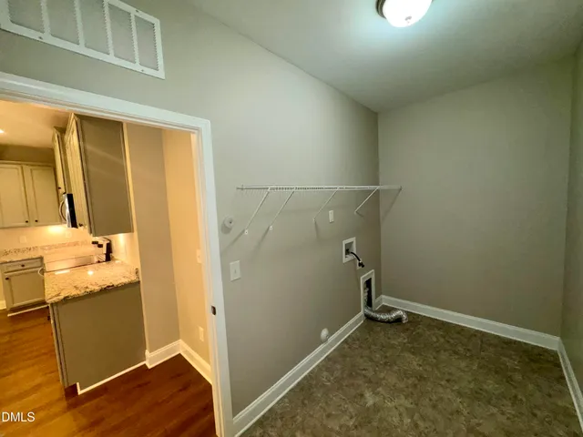 a large kitchen with stainless steel appliances granite countertop a sink and a stove