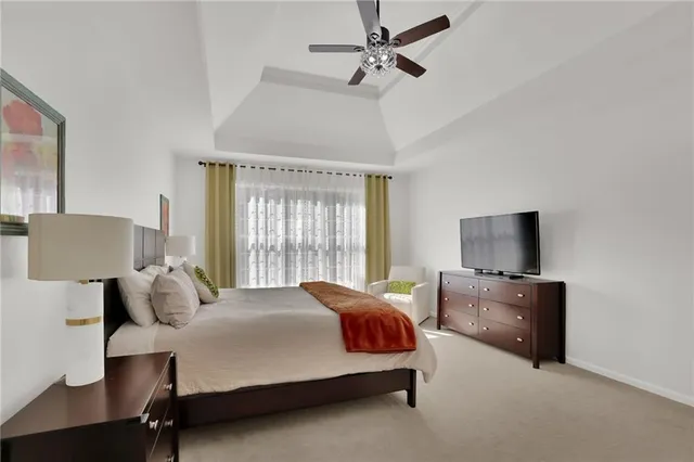 a bedroom with a bed and a chair