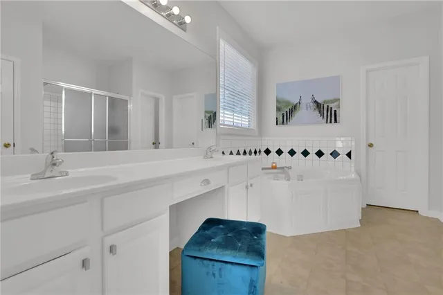 a bathroom with a bathtub and a sink