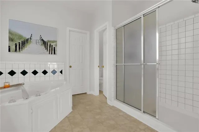 a bathroom with a shower and a sink