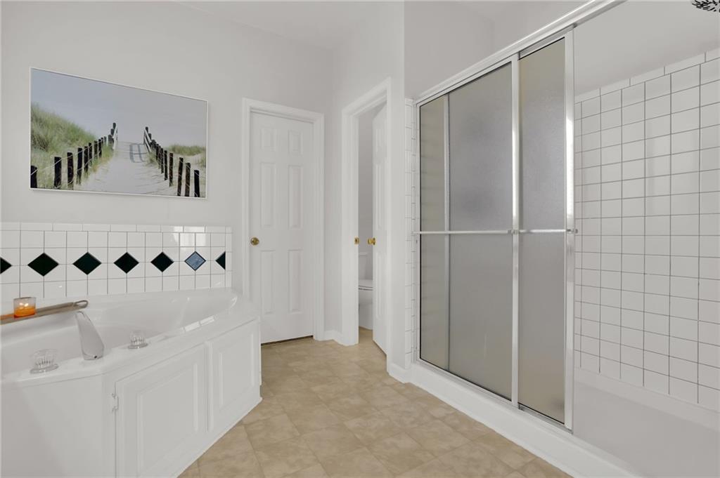 520 Ruby Forest Parkway Suwanee, GA 30024 - Photo 17 of 37 a bathroom with a shower and a sink