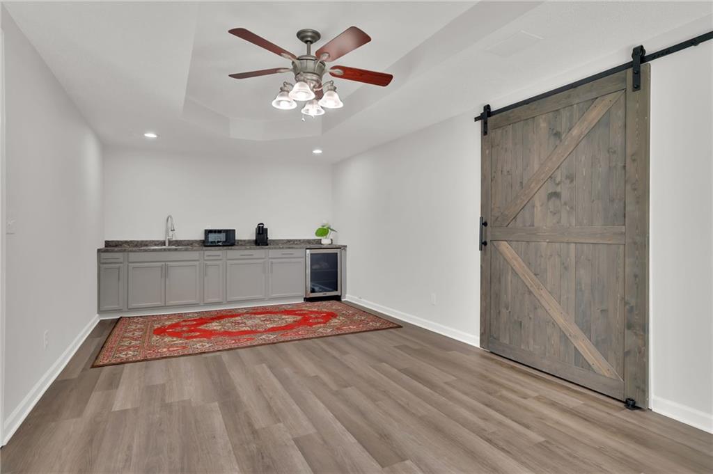 520 Ruby Forest Parkway Suwanee, GA 30024 - Photo 26 of 37 a view of a hallway with a chandelier
