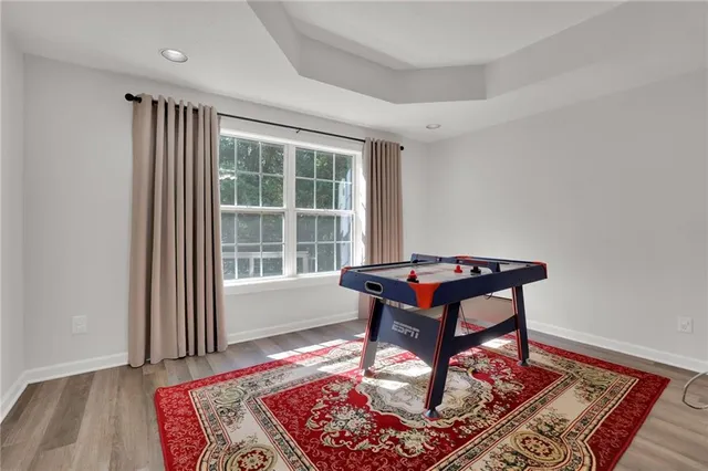 a room with furniture rug and window