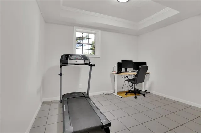 a view of a workspace with furniture and windows