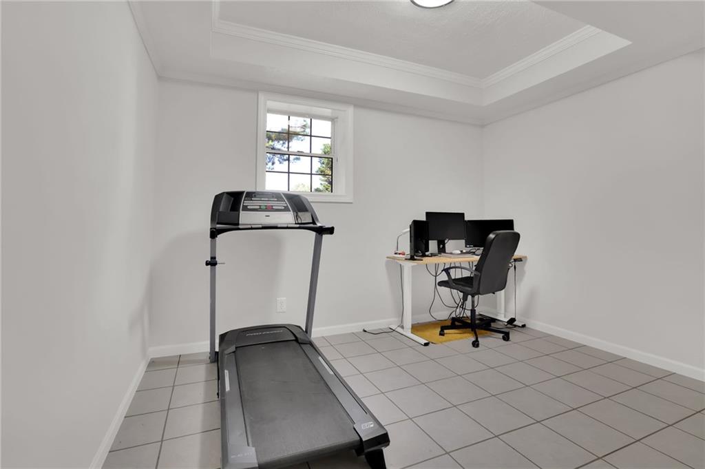 520 Ruby Forest Parkway Suwanee, GA 30024 - Photo 30 of 37 a view of a workspace with furniture and windows
