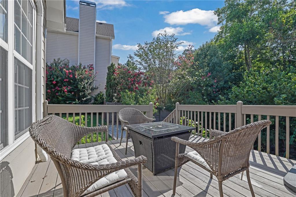 520 Ruby Forest Parkway Suwanee, GA 30024 - Photo 32 of 37 a view of a chair and table on the roof deck
