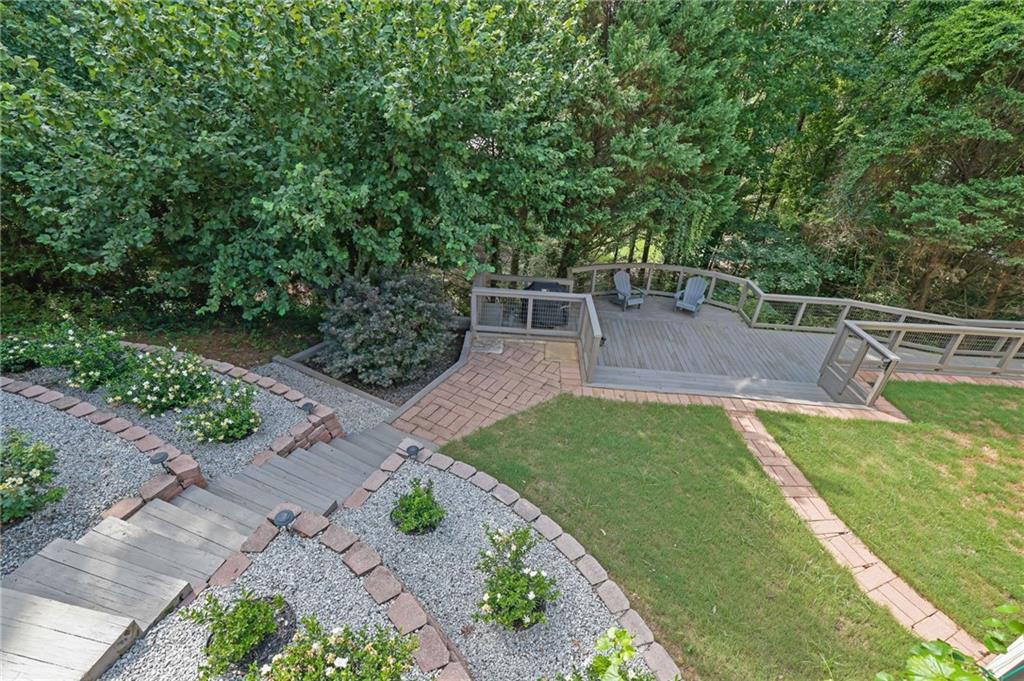 520 Ruby Forest Parkway Suwanee, GA 30024 - Photo 33 of 37 a view of a backyard with sitting area