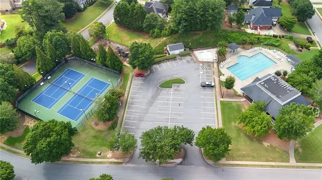 an aerial view of a house with garden space and street view