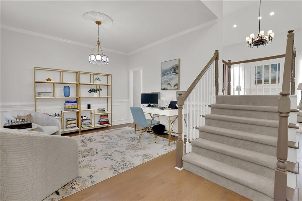 520 Ruby Forest Parkway Suwanee, GA 30024 - Photo 4 of 37 a view of hall way with furniture and stairs