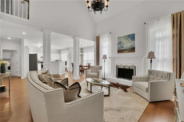 a living room with furniture and a fireplace