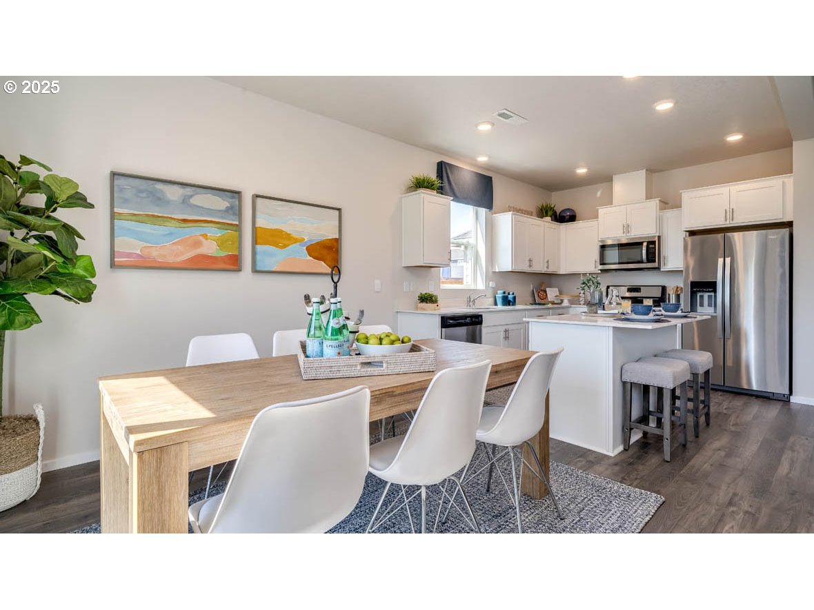 2343 30th Place Springfield, OR 97477 - Photo 15 of 29 a kitchen with a table and chairs in it