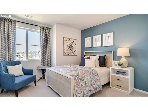 a bedroom with a bed and a couch