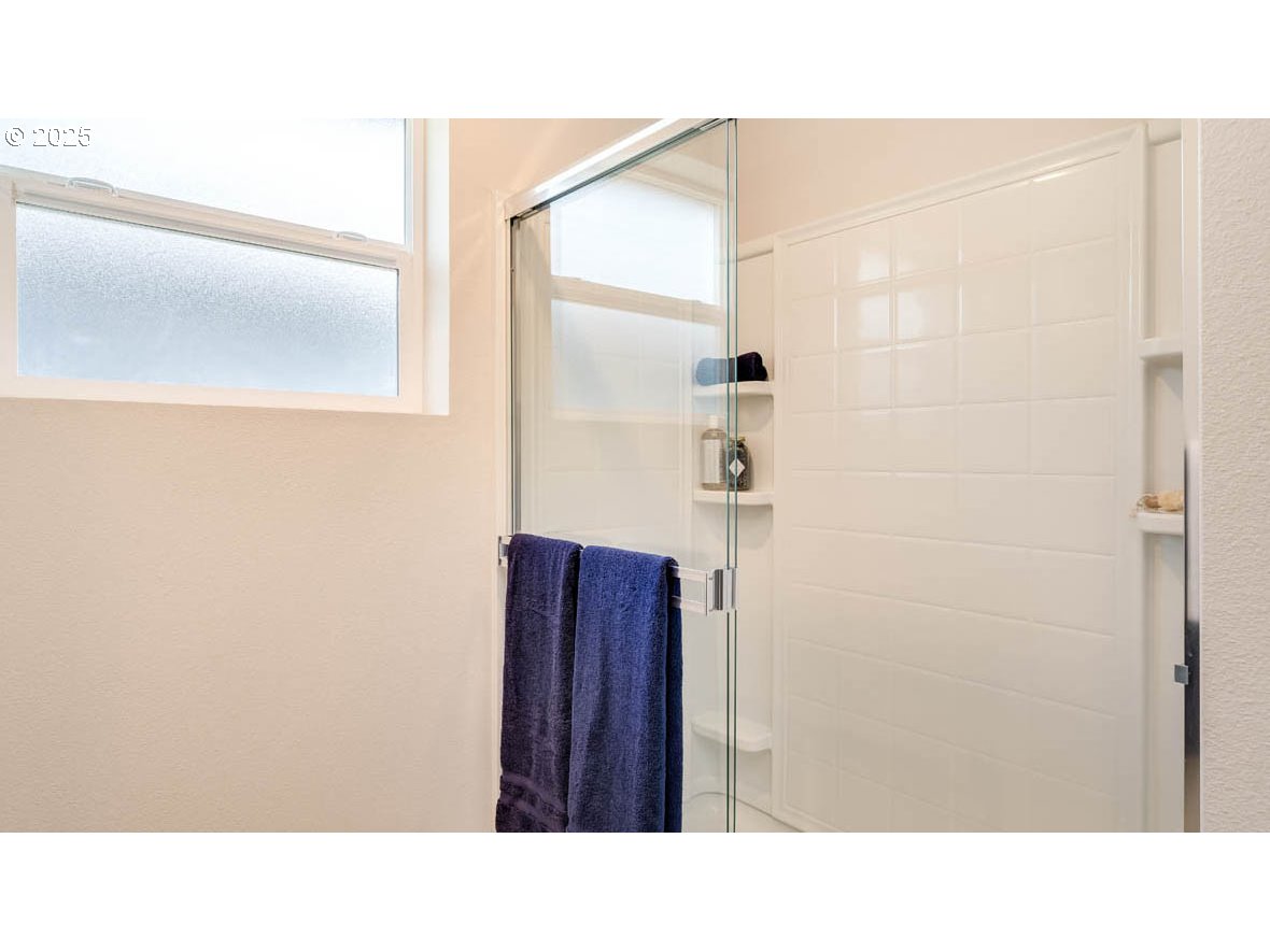 2343 30th Place Springfield, OR 97477 - Photo 25 of 29 a bathroom with a sink and a mirror