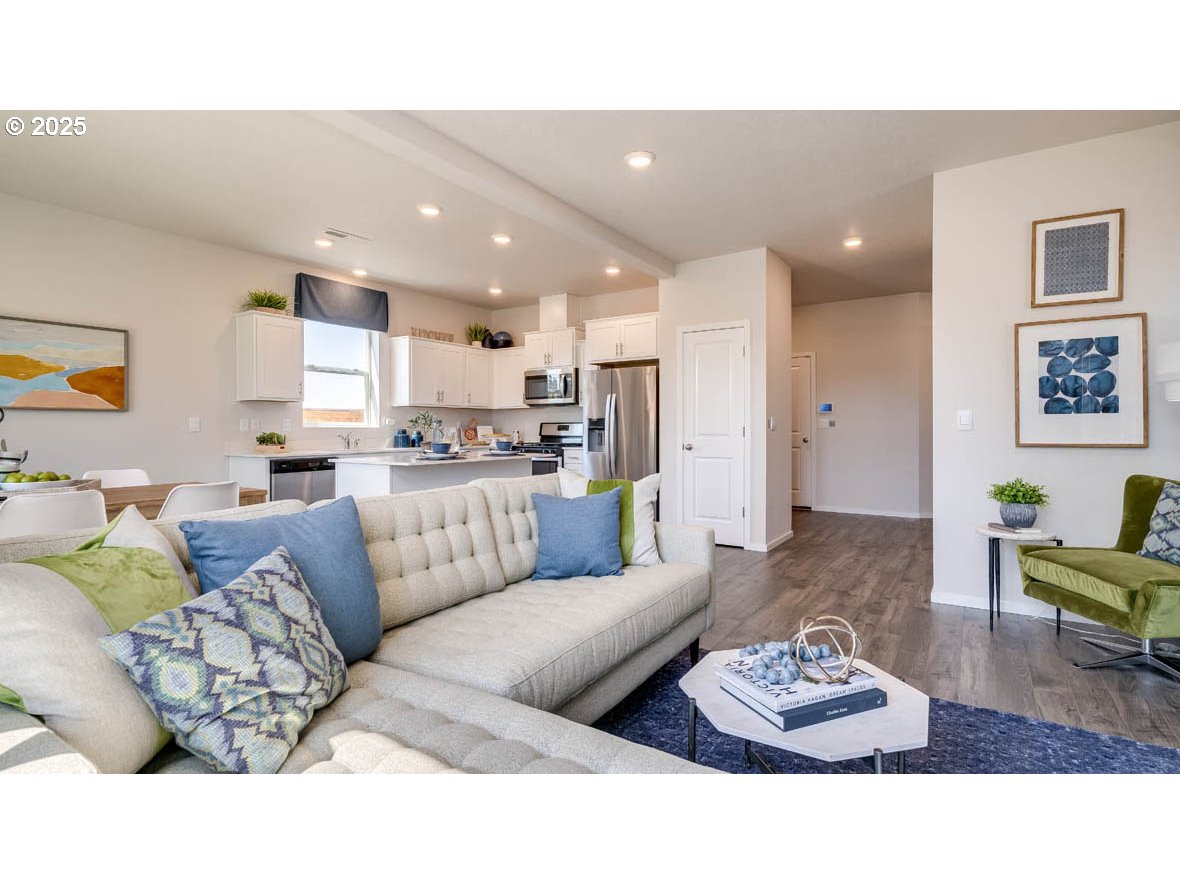 2343 30th Place Springfield, OR 97477 - Photo 7 of 29 a living room with furniture and a dining table with kitchen view